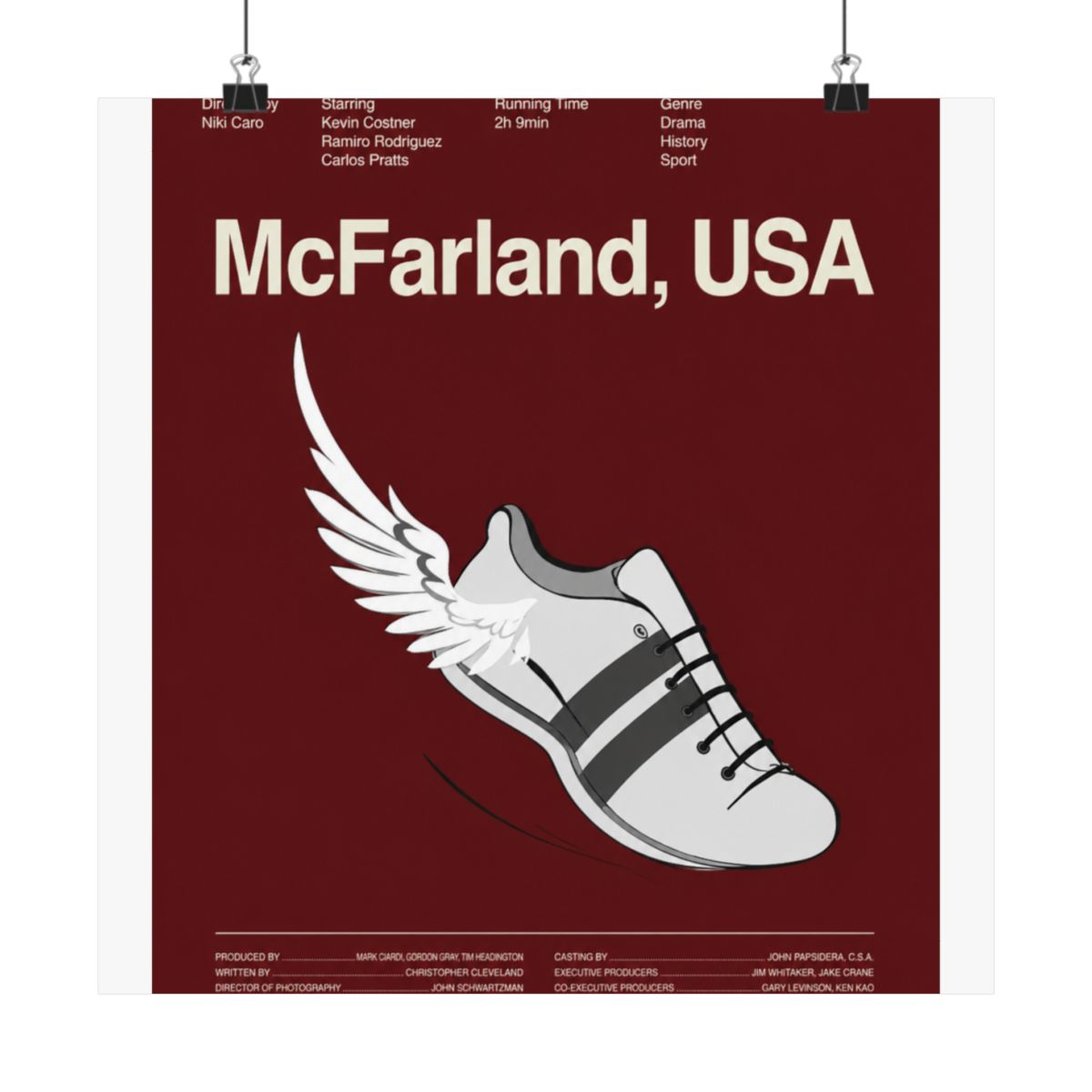 Poster featuring the movie title "McFarland, USA" with a stylized running shoe with wings. The shoe is white with black stripes and laces, set against a burgundy background. The poster is hanging on a...